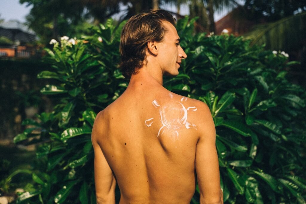 Shirtless Man with Sunscreen