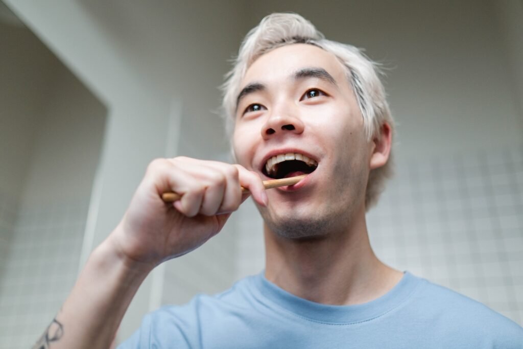 man brushing his teeth