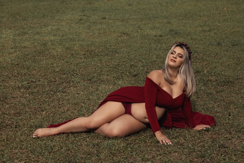 A Pregnant Woman Posing on the Grass