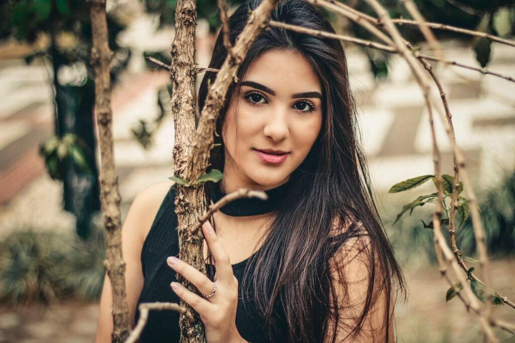 Photo Of Woman Holding Tree Branch