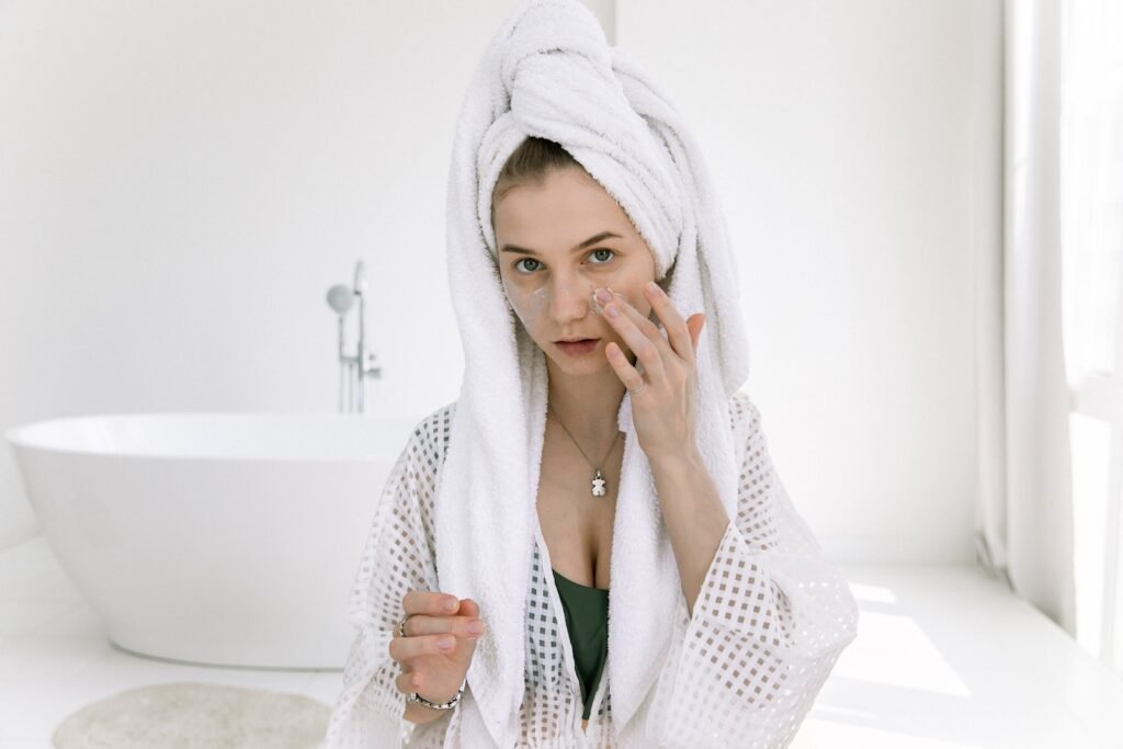 Woman Applying Cosmetics On Her Face