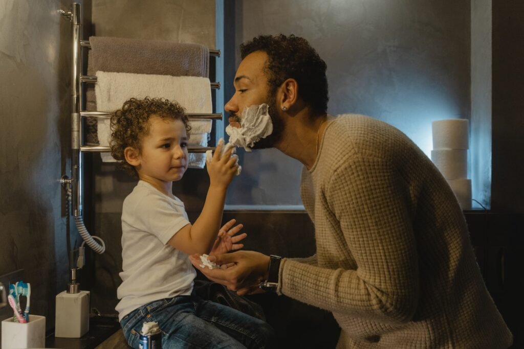 Child Putting Shaving Cream to His Father