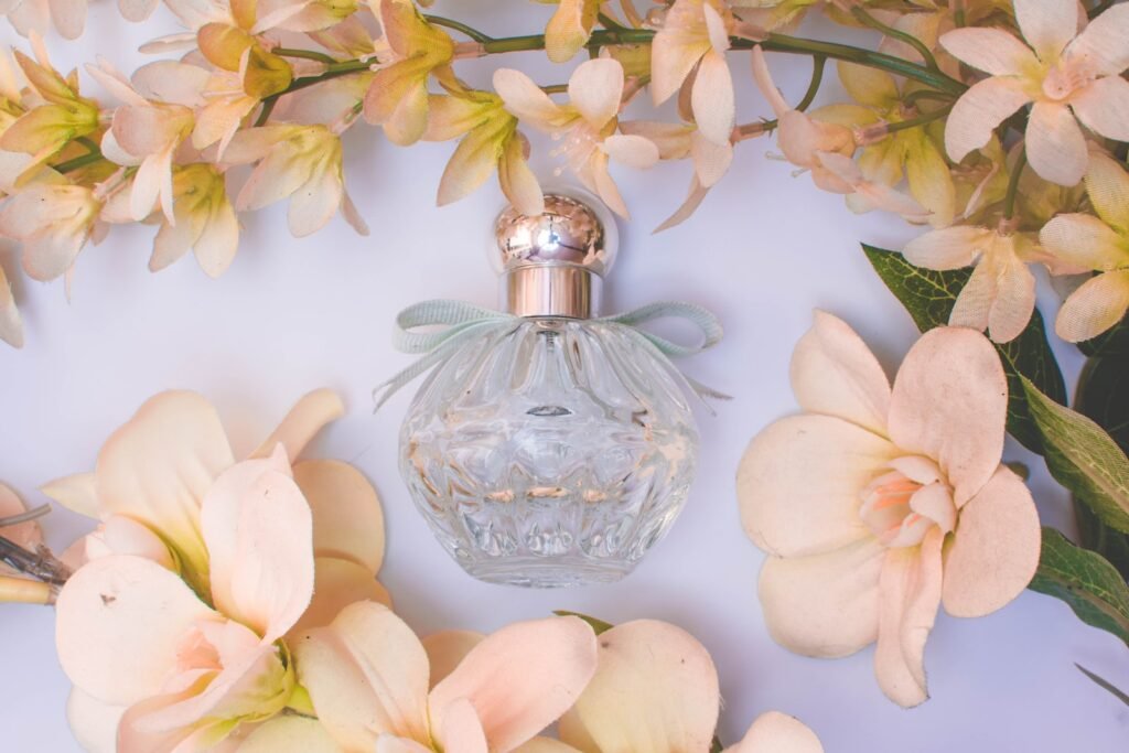 glass perfume bottle with white flowers